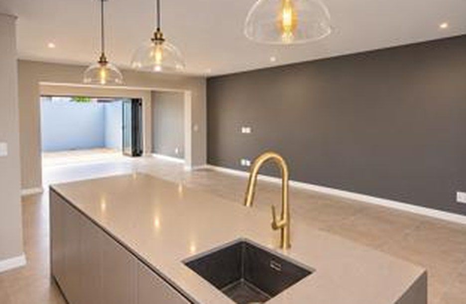 Open-plan kitchen with stone island